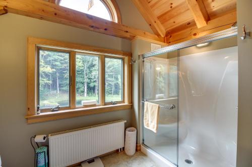 a bathroom with a shower and a window at Chester Home with Views about 10 Mi to Okemo Mtn Resort! in Chester