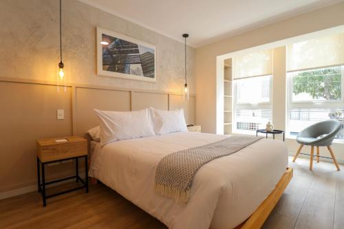 Ένα ή περισσότερα κρεβάτια σε δωμάτιο στο Mirano by Wynwood House