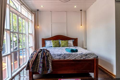 Een bed of bedden in een kamer bij La Casa De Jardin
