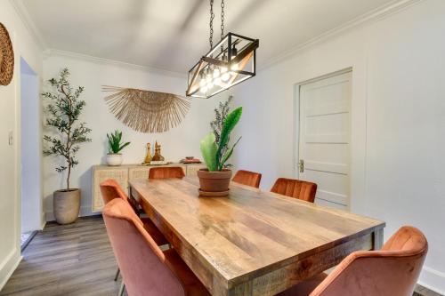 a dining room with a wooden table and chairs at Fire Pit and Yard Updated Winter Garden Home! in Orlando