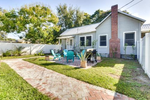 a backyard with a house and a patio at Fire Pit and Yard Updated Winter Garden Home! in Orlando