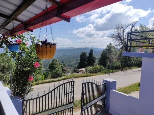 a view from the balcony of a house at The Heavens in Almora