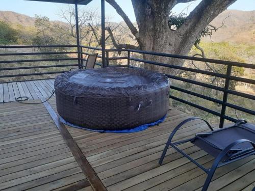 a large tire sitting on top of a wooden deck at Glamping en Playa Potrero in Potrero