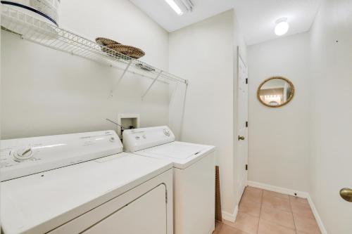 a laundry room with a washer and dryer at Sun Beam in St Petersburg