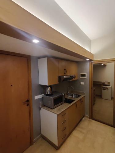 Kuchyň nebo kuchyňský kout v ubytování Bliss 3000 Furnished Studios