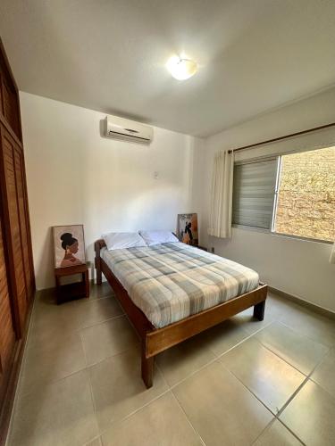 Postel nebo postele na pokoji v ubytování Residencial Mansur - Jurerê