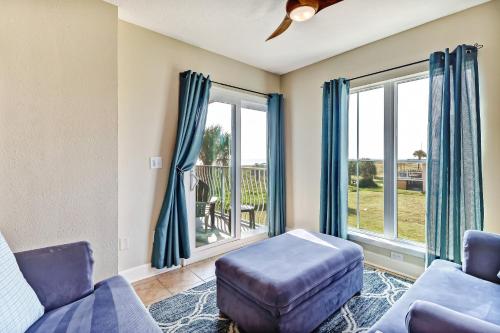 a living room with a couch and a chair at 103 Terraces at Beachside in Amelia Island