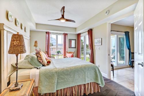 a bedroom with a bed and a ceiling fan at 103 Terraces at Beachside in Amelia Island