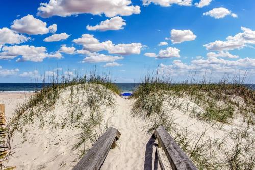 a path through the sand at the beach at 105 Terraces at Beachside in Fernandina Beach