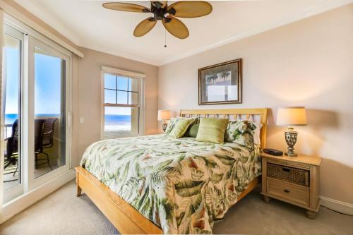 a bedroom with a bed and a ceiling fan at 52 Ocean Place in Amelia Island