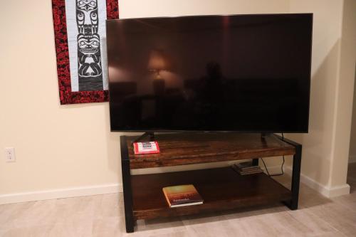 a flat screen tv sitting on top of a table at Fireweed House in Fairbanks