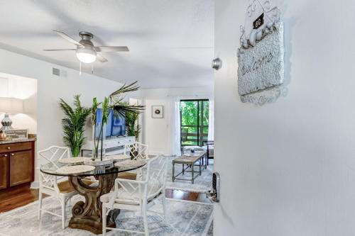 a dining room and living room with a table and chairs at Amelia Landings 6C in Amelia Island