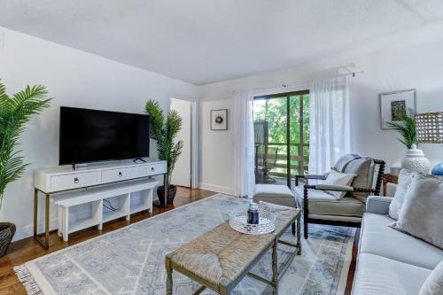 a living room with a tv and a couch at Amelia Landings 6C in Amelia Island