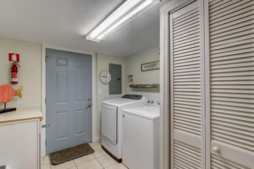 a laundry room with a washer and dryer at Sea Castles #3 in Amelia Island