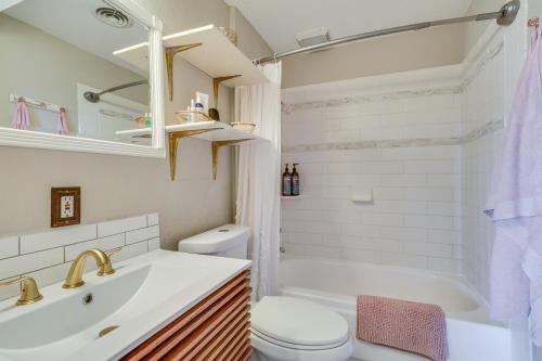 a white bathroom with a sink and a toilet at Chic Columbia City Vacation Rental with Kayaks! 