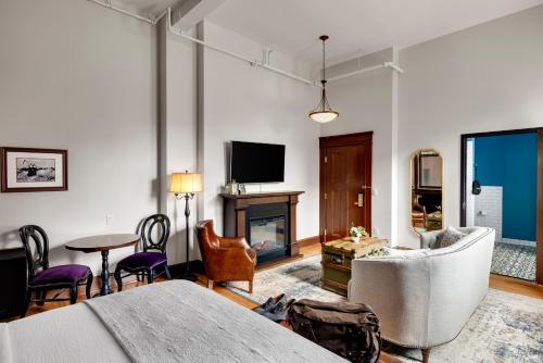 a living room with a couch and a fireplace at Celeste of St Paul in Saint Paul