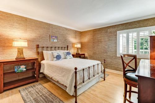 a bedroom with a bed and a desk and a window at 2123 Beach Wood in Amelia Island