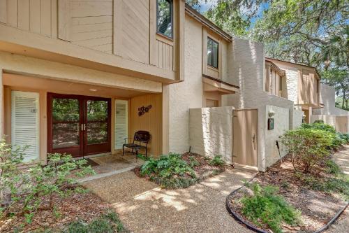 a house with a door and a chair in front of it at 2091 Beach Wood in Amelia Island
