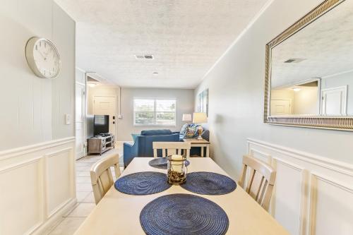 a dining room with a table and a mirror at 2810 Ohio Avenue #1 in Amelia Island