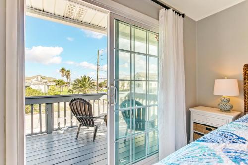 a bedroom with a bed and a balcony with a view at 2810 Ohio Avenue #1 in Amelia Island