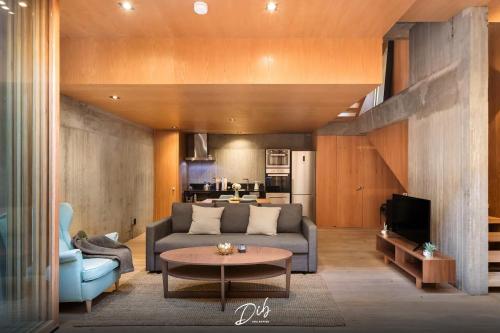 a living room with a couch and a table at DIB Collection - Modern Stays in Roma Norte in Mexico City