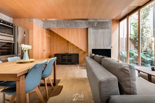 a living room with a table and a couch at DIB Collection - Modern Stays in Roma Norte in Mexico City