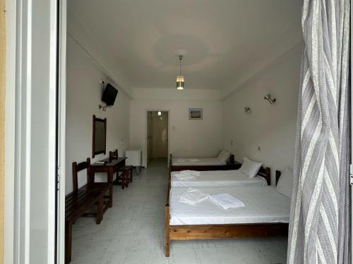 Postel nebo postele na pokoji v ubytování Hotel Galini
