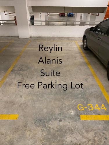 a parking lot with a car parked in it at Reylin Alanis Suite // Free Wifi & Netflix // Airport Shuttle Service in Sepang