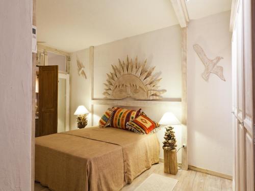 A bed or beds in a room at Smart Appart Villa Patrizia