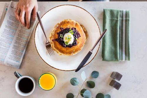 a plate of pancakes with an egg on a table at The Westin Carlsbad Resort & Spa in Carlsbad