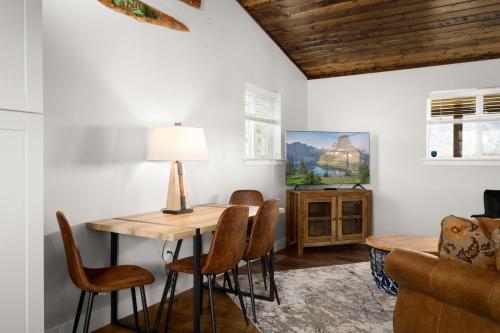 a dining room with a table and chairs at The Kabins in Columbia Falls