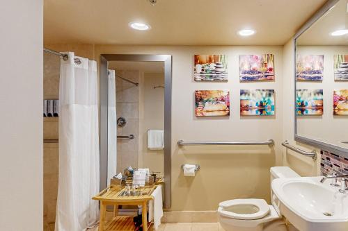 a bathroom with a shower toilet and a sink at Views of the City, 1002 in Fort Lauderdale