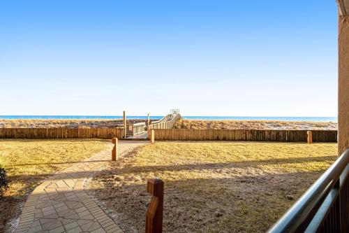 a view of the beach from the balcony of a house at Navarre Towers 602 in Navarre