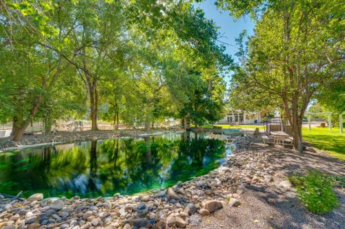 a pool of water in a park with trees at Cozy Idaho Retreat with Grill and Fire Pit! in Caldwell