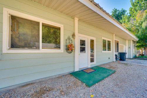 a house with a door and a window at Cozy Idaho Retreat with Grill and Fire Pit! in Caldwell