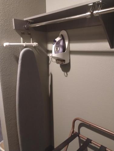 a bathroom with a toilet with a security camera at Quality Inn & Suites Wilsonville in Wilsonville