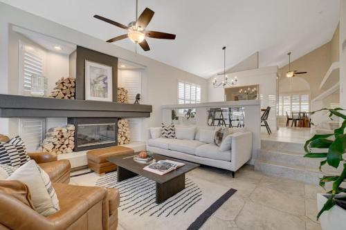 a living room with a couch and a fireplace at Beautiful 5BR w/King Beds, Pool & Hot Tub, Games in Las Vegas