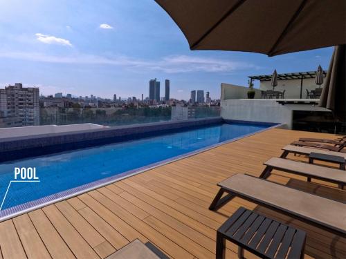 a swimming pool on the roof of a building at Amazing City Views Condesa Roma By Bamboo Skylife in Mexico City