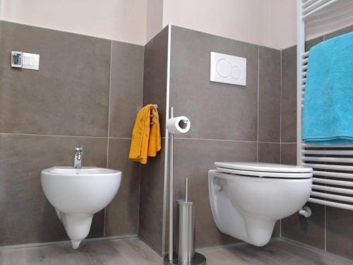 a bathroom with a toilet and a sink at Appartamenti Centro Seriate in Seriate