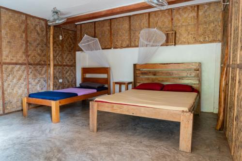 A bed or beds in a room at Soffta Surf Ranch