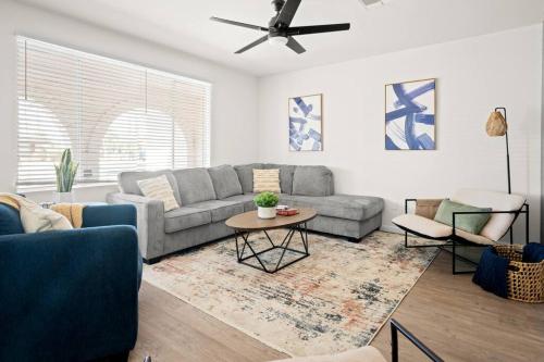 a living room with a couch and a table at Tempe STR/MTR-close to ASU, Old Town & PHX airport in Tempe