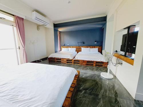 Postel nebo postele na pokoji v ubytování Ayo Socks Homestay
