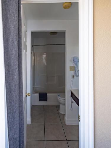 a bathroom with a shower and a toilet in it at Bryce Trails Bed and Breakfast in Tropic
