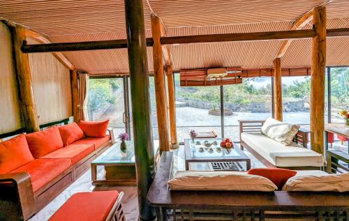 a living room with a couch and a table at Sapawine Homestay in Sa Pa