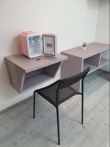 a chair in front of a desk with a tv at Hotel PM Polanco in Mexico City