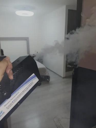 a person is using a machine to clean a floor at Hotel PM Polanco in Mexico City