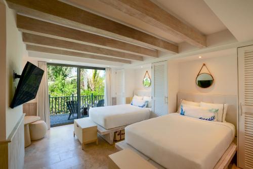 Postel nebo postele na pokoji v ubytování Naay Boutique Hotel Holbox