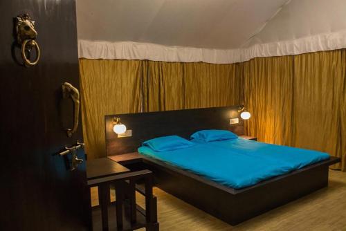 Llit o llits en una habitació de Trident Jungle Stay