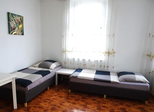 Un pat sau paturi într-o cameră la Apartment Essen-City