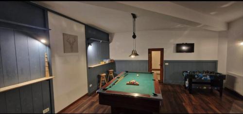 a billiard room with a pool table in it at Chalet Poarta in Bran